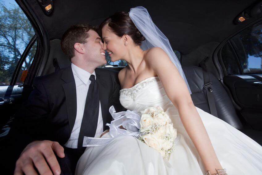 bride-and-groom-in-limo